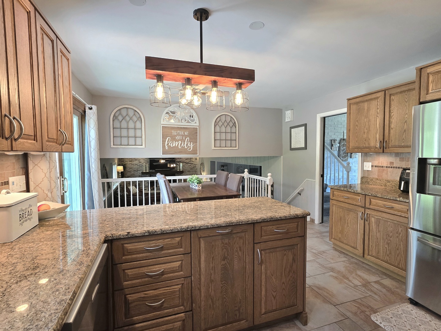 574 Aberdeen Road Frankfort, IL 60423 - Photo 7 of 37 a kitchen with stainless steel appliances kitchen island granite countertop a stove a sink dishwasher and a refrigerator with wooden floor