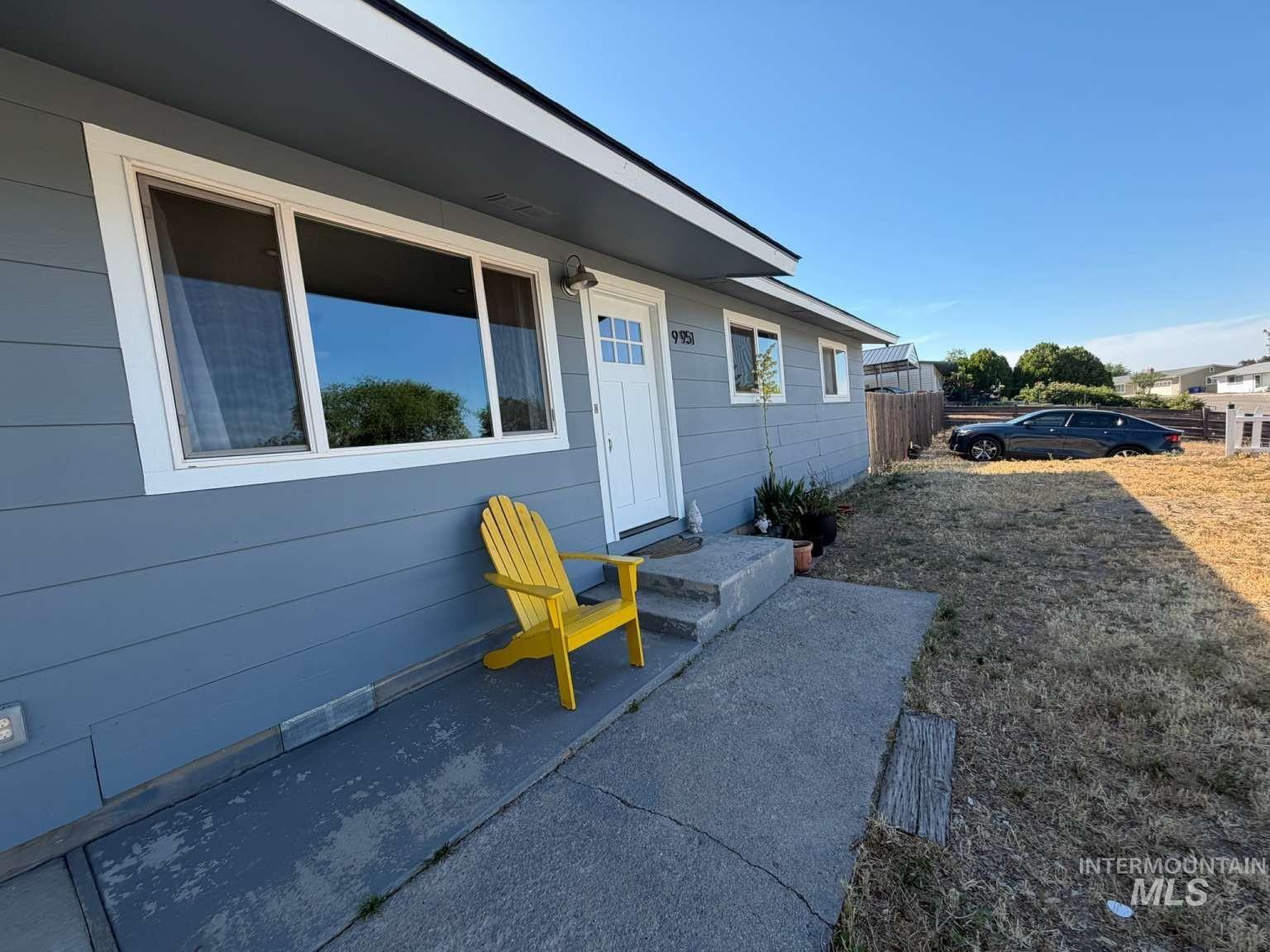 9951 West Fox Ridge Drive Boise, ID 83709 - Photo 2 of 13 Exterior featuring light blue horizontal siding with white trim
