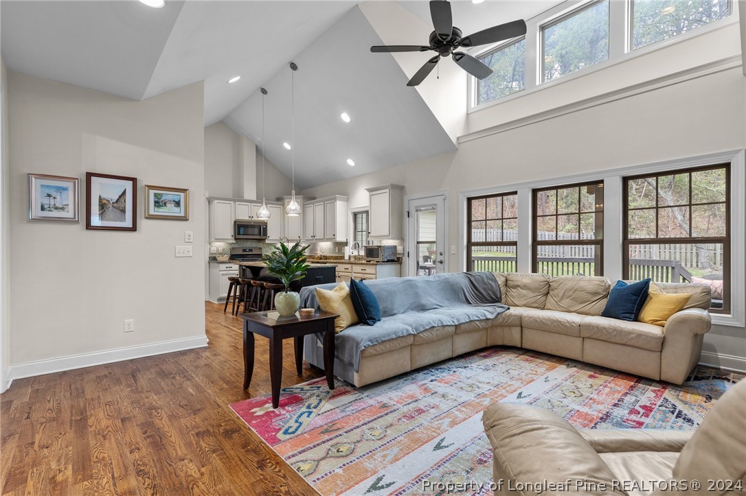 208 Rob Roy Road Southern Pines, NC 28387 - Photo 11 of 48 a living room with furniture or couch and a large window