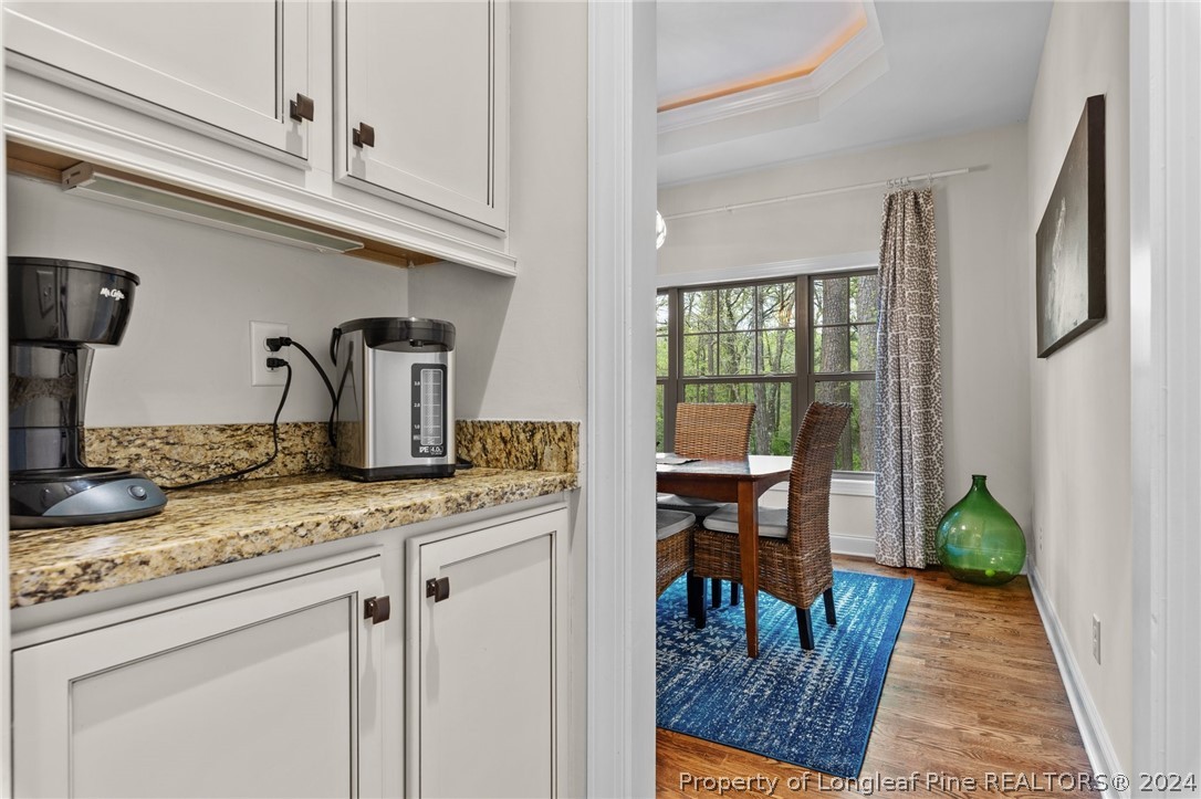 208 Rob Roy Road Southern Pines, NC 28387 - Photo 17 of 48 a kitchen with stainless steel appliances granite countertop a stove a sink and a dining table
