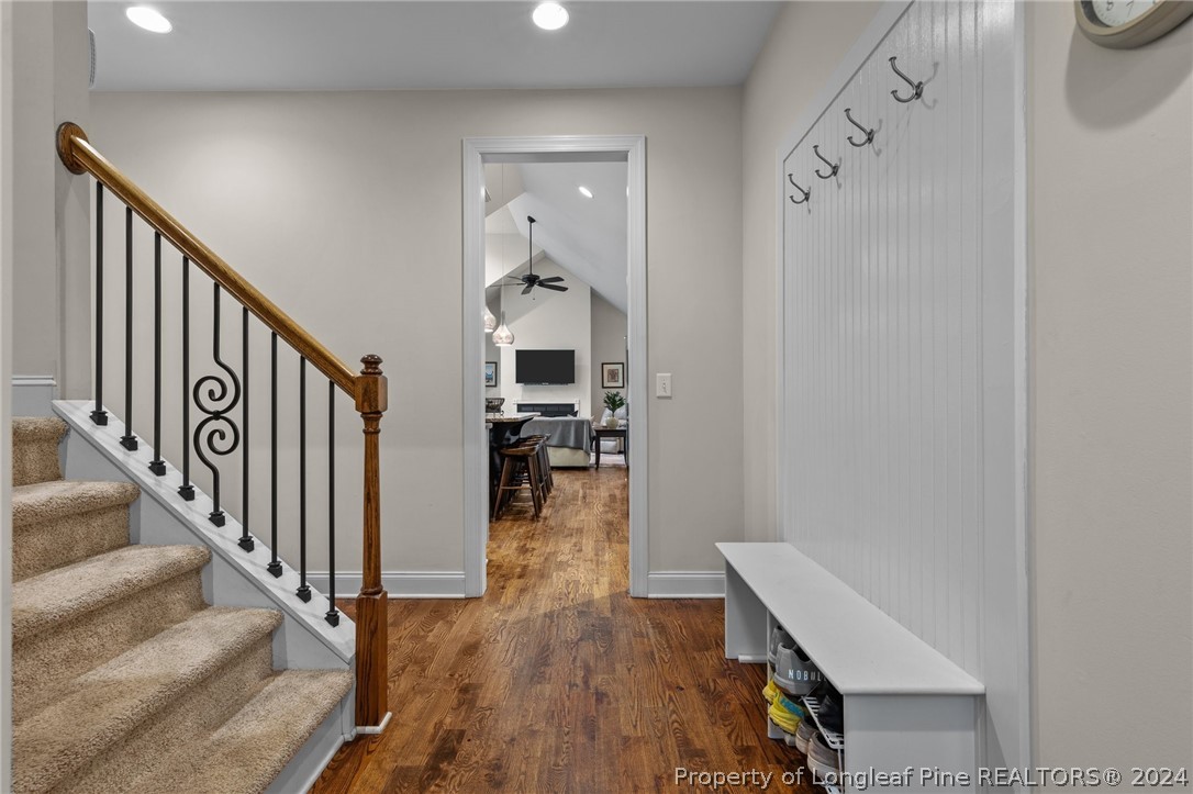 208 Rob Roy Road Southern Pines, NC 28387 - Photo 25 of 48 a view of a hallway with wooden floor and staircase
