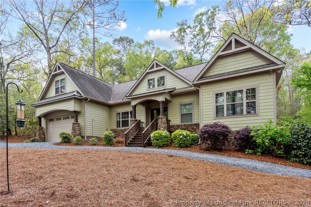 208 Rob Roy Road Southern Pines, NC 28387 - Photo 3 of 48 a front view of a house with garden