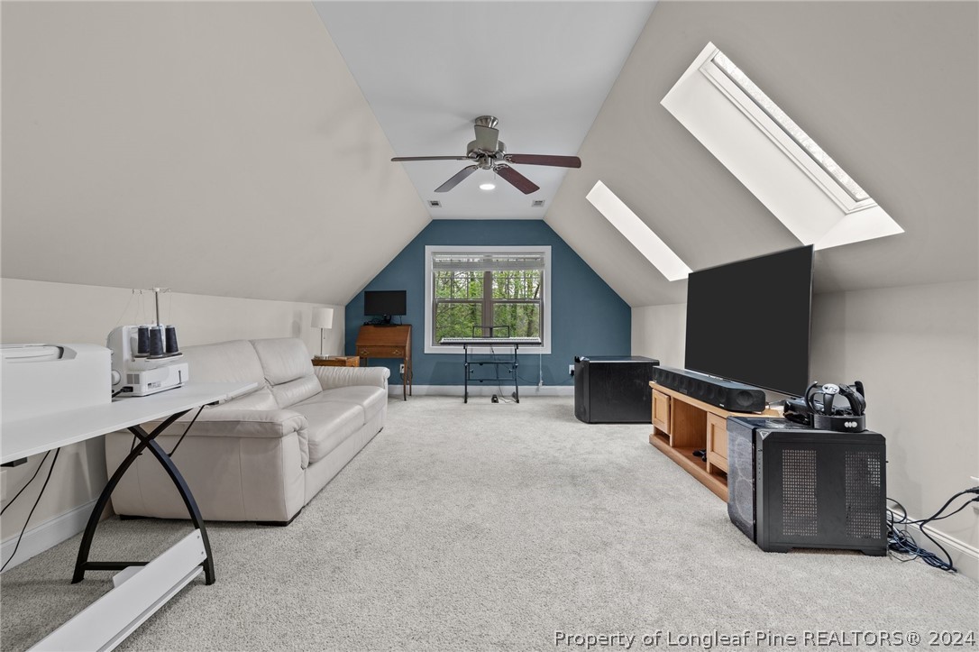 208 Rob Roy Road Southern Pines, NC 28387 - Photo 33 of 48 a living room with furniture a window and a flat screen tv