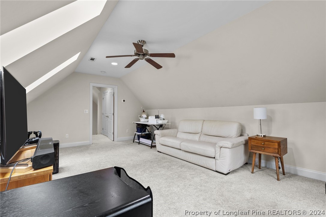 208 Rob Roy Road Southern Pines, NC 28387 - Photo 34 of 48 a living room with furniture and a flat screen tv