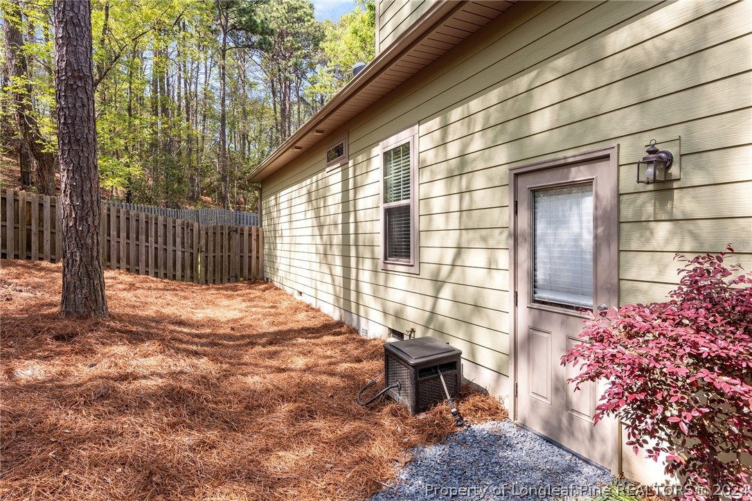 208 Rob Roy Road Southern Pines, NC 28387 - Photo 37 of 48 a backyard of a house with table and chairs