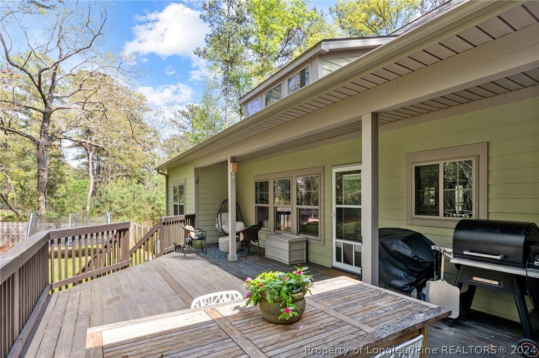 208 Rob Roy Road Southern Pines, NC 28387 - Photo 44 of 48 a view of a house with lounge chair and wooden floor