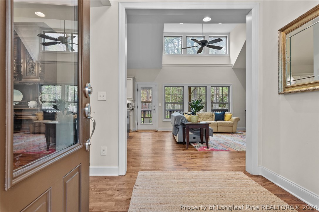 208 Rob Roy Road Southern Pines, NC 28387 - Photo 7 of 48 a living room with furniture and a potted plant
