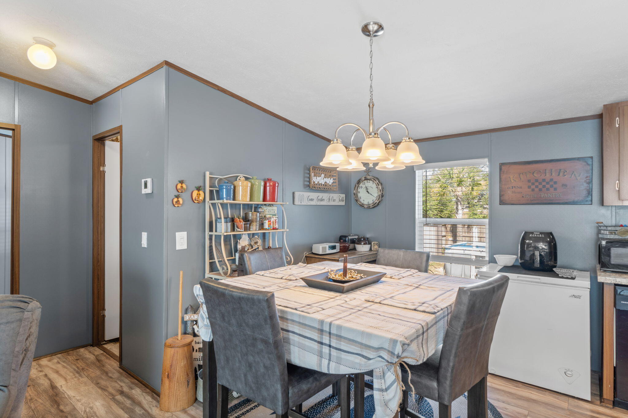 8680 John Hamm Road Milton, FL 32583 - Photo 11 of 44 a dining room with furniture and window