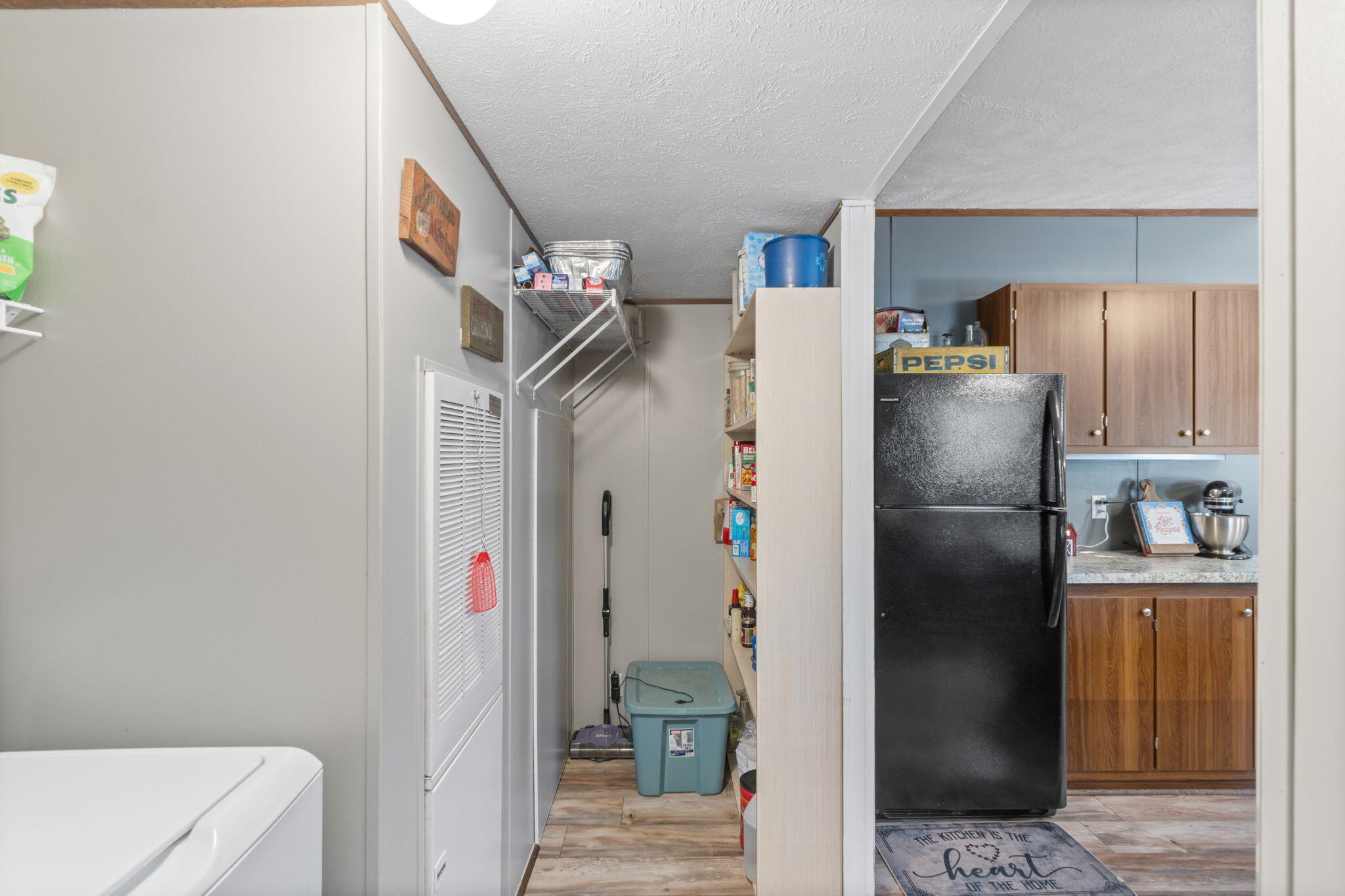8680 John Hamm Road Milton, FL 32583 - Photo 17 of 44 a kitchen with a refrigerator and a sink