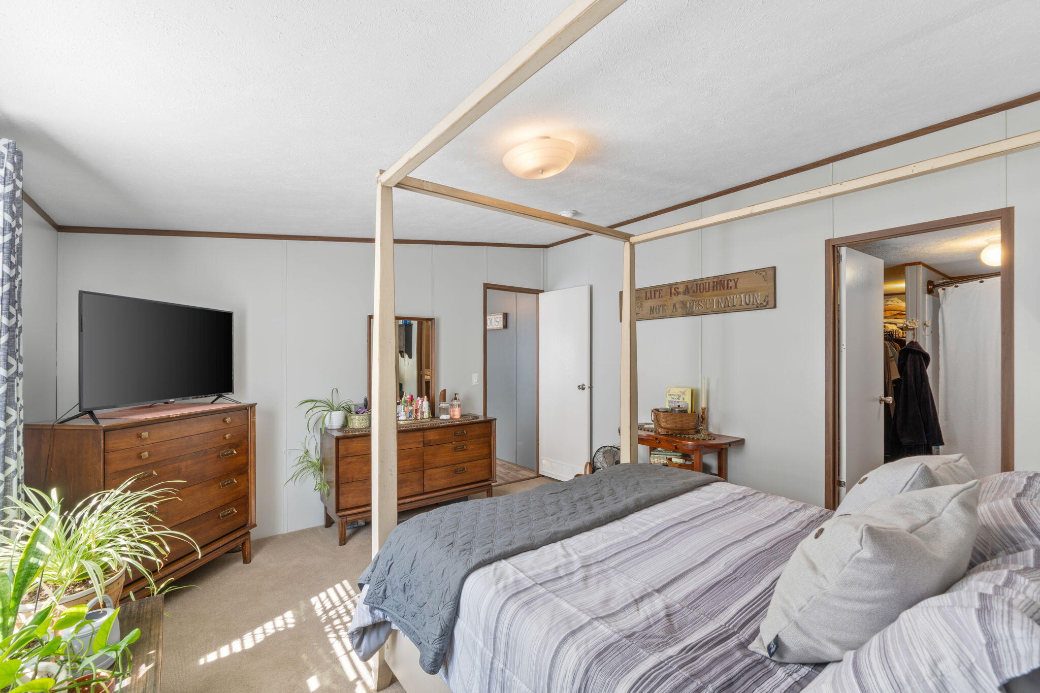 8680 John Hamm Road Milton, FL 32583 - Photo 19 of 44 a bedroom with a bed and a flat screen tv