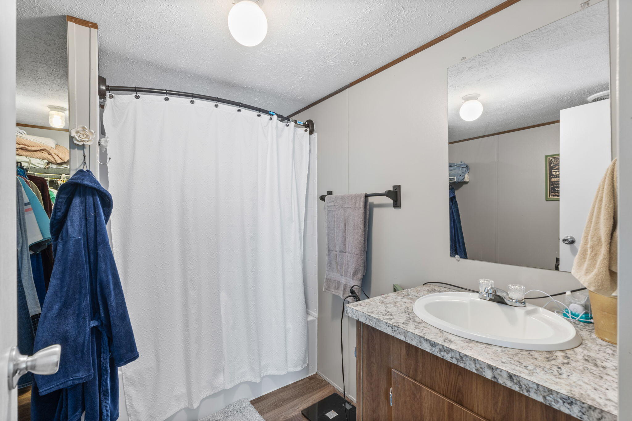 8680 John Hamm Road Milton, FL 32583 - Photo 20 of 44 a bathroom with a granite countertop sink and a mirror