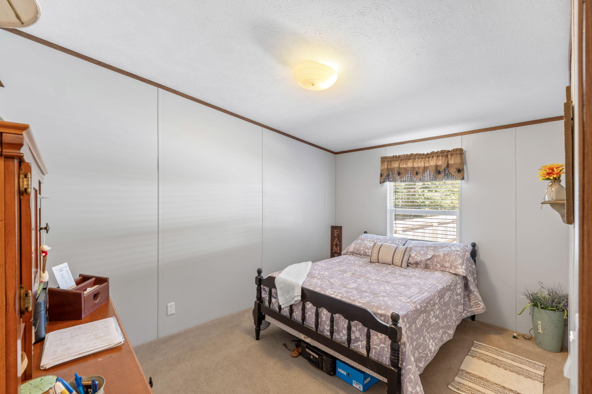 8680 John Hamm Road Milton, FL 32583 - Photo 22 of 44 a bedroom with a bed and a window