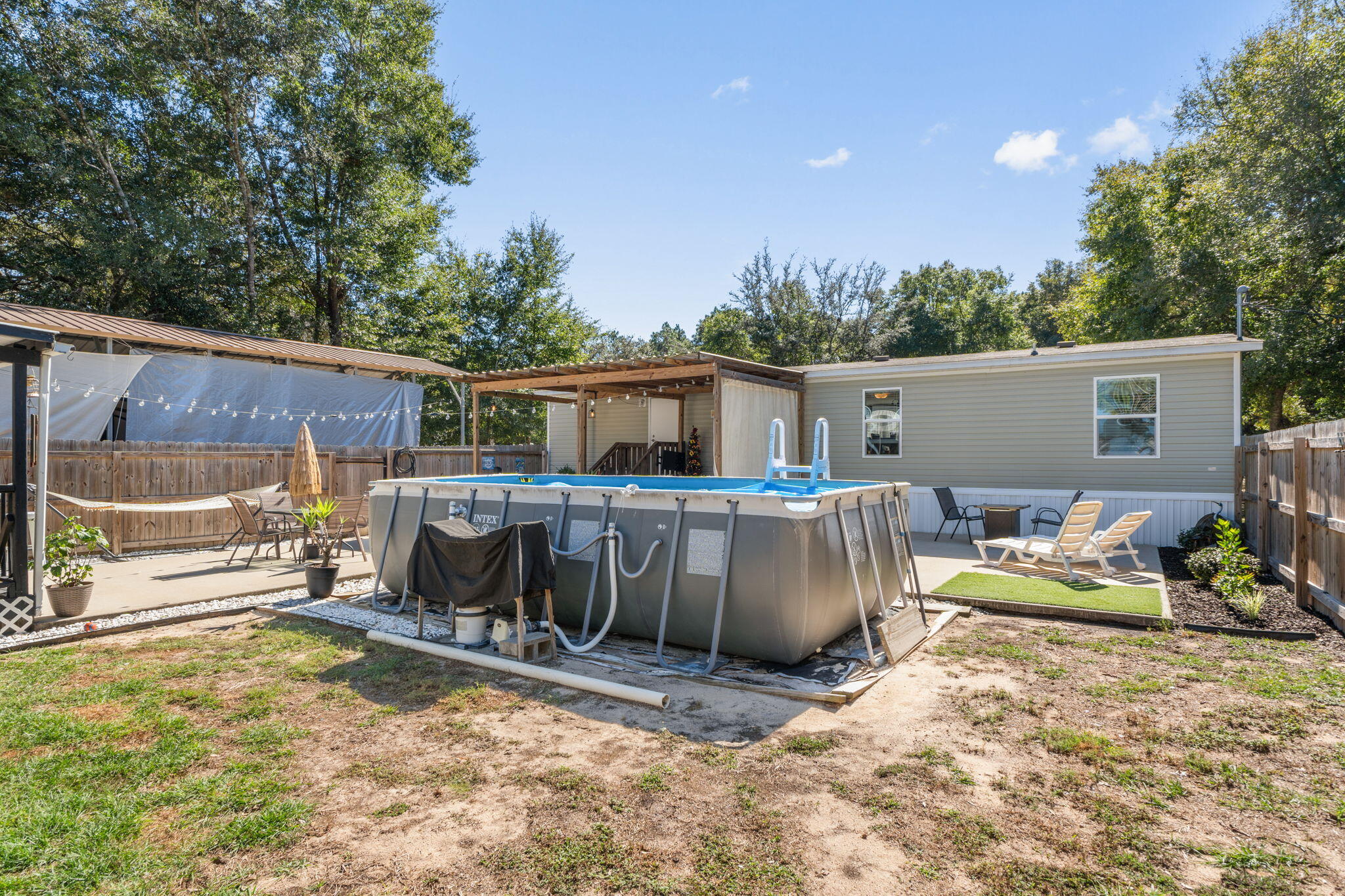 8680 John Hamm Road Milton, FL 32583 - Photo 31 of 44 a view of a house with backyard and sitting area