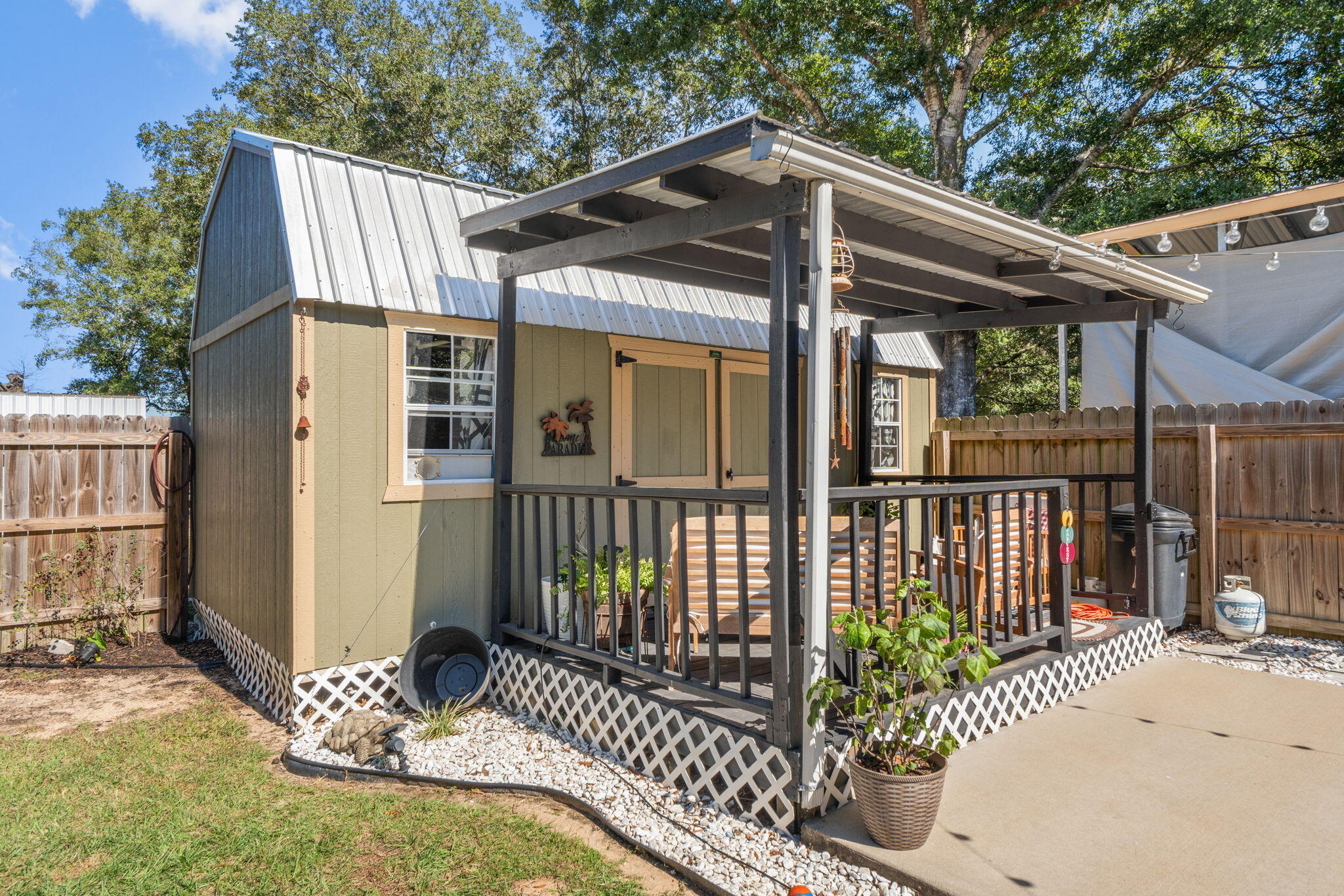 8680 John Hamm Road Milton, FL 32583 - Photo 32 of 44 a view of a house with a small yard and wooden fence