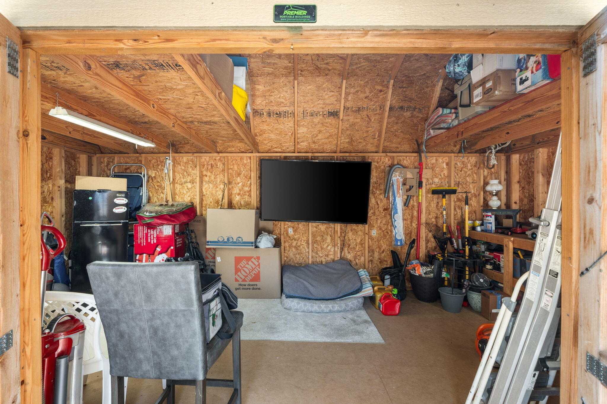 8680 John Hamm Road Milton, FL 32583 - Photo 33 of 44 a living room with furniture and a flat screen tv