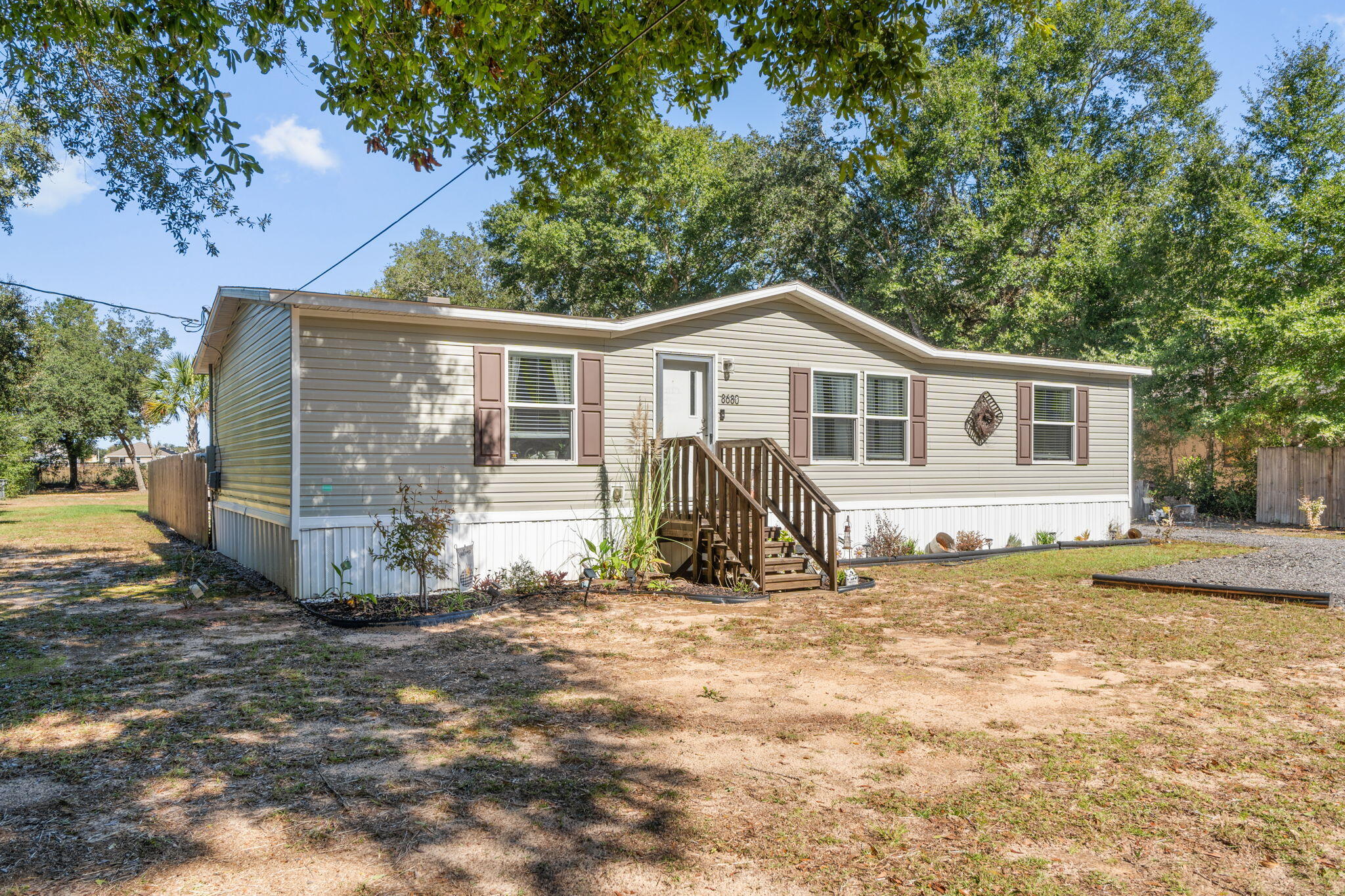 8680 John Hamm Road Milton, FL 32583 - Photo 5 of 44 a view of a house with a yard