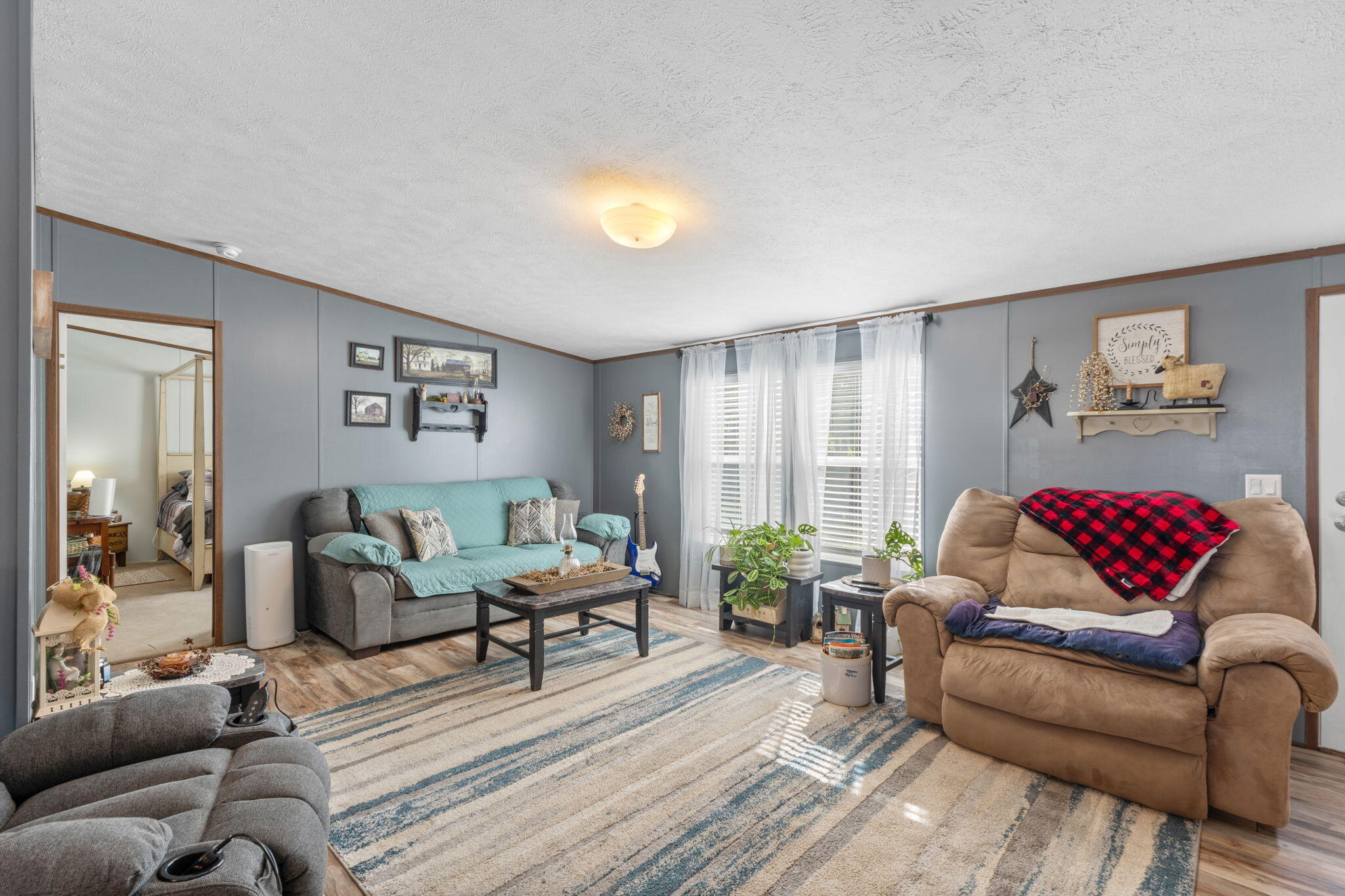 8680 John Hamm Road Milton, FL 32583 - Photo 7 of 44 a living room with furniture and a wooden floor
