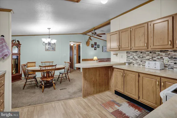 a kitchen with granite countertop sink cabinets and stainless steel appliances