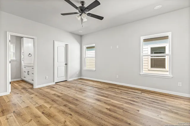 a view of an empty room with a window