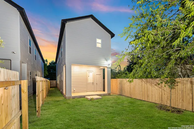 a view of backyard with cabin