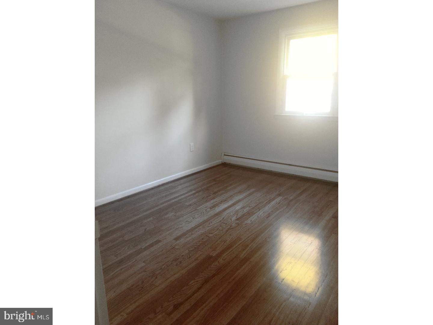 116 Bartholomew Road Berwyn, PA 19312 - Photo 12 of 24 a view of an empty room and wooden floor