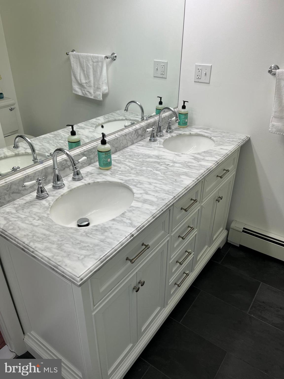 116 Bartholomew Road Berwyn, PA 19312 - Photo 4 of 24 a bathroom with double sink and a mirror