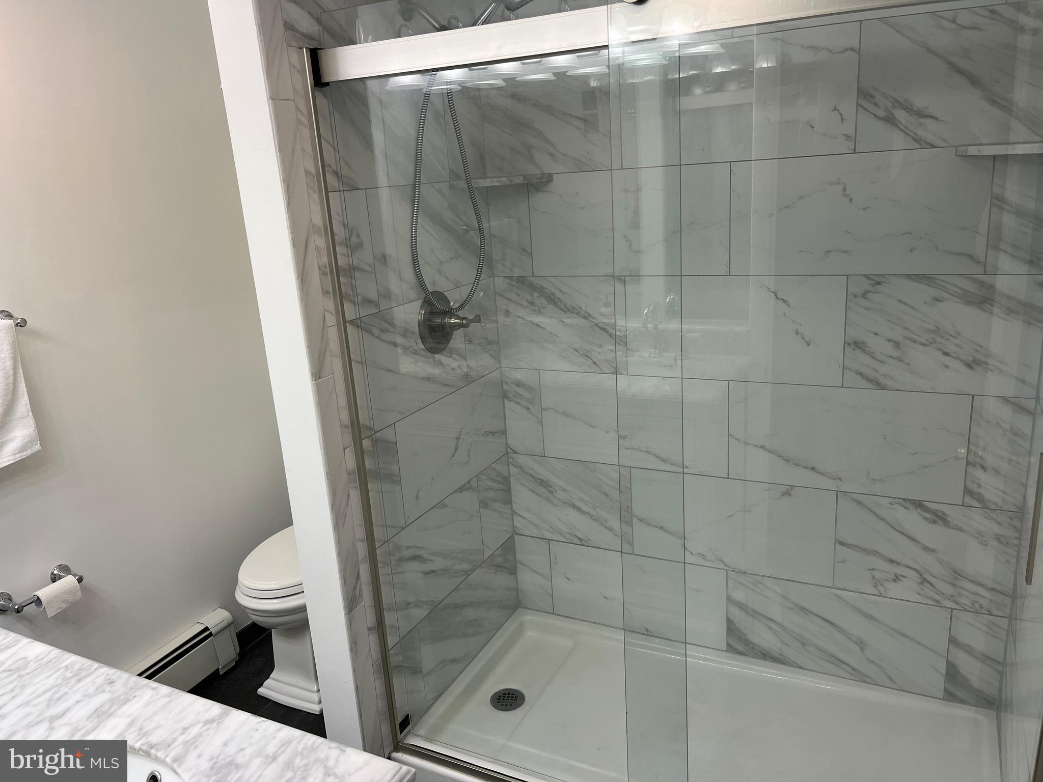 116 Bartholomew Road Berwyn, PA 19312 - Photo 5 of 24 a bathroom with a shower and a toilet