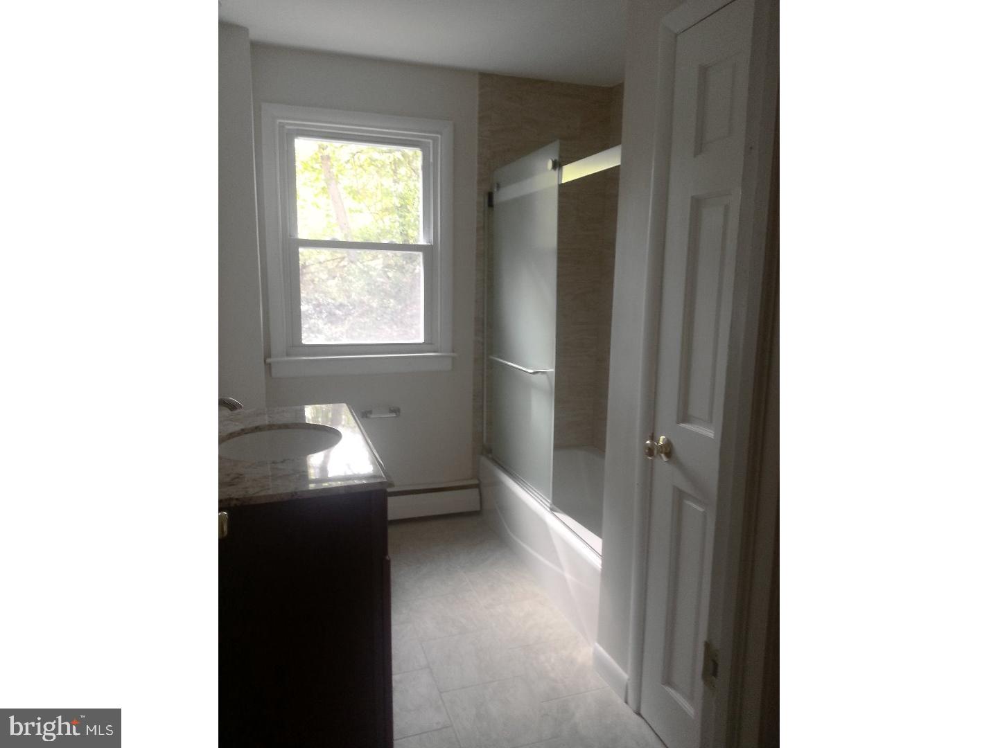 116 Bartholomew Road Berwyn, PA 19312 - Photo 9 of 24 a view of an empty room with a window