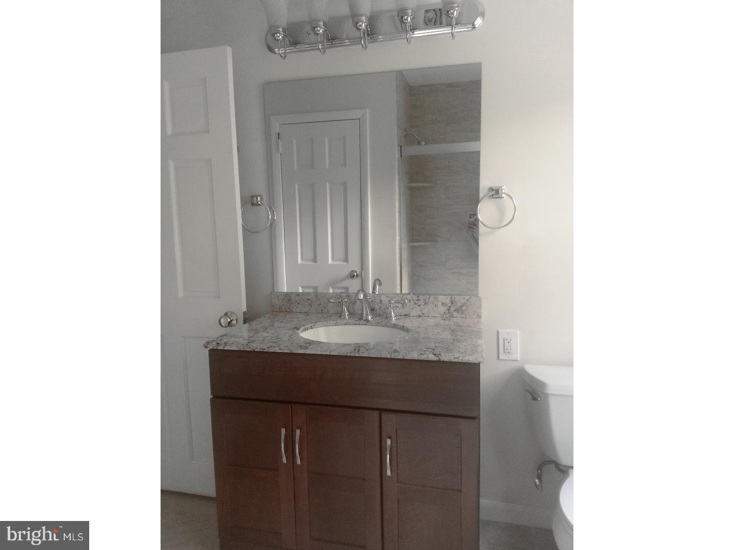 116 Bartholomew Road Berwyn, PA 19312 - Photo 10 of 24 a bathroom with a granite countertop sink and a mirror