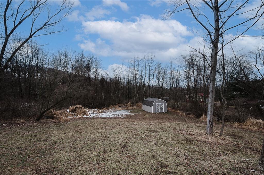 821 Windy Acres Road Saltsburg, PA 15681 - Photo 12 of 31 a view of a backyard with large trees