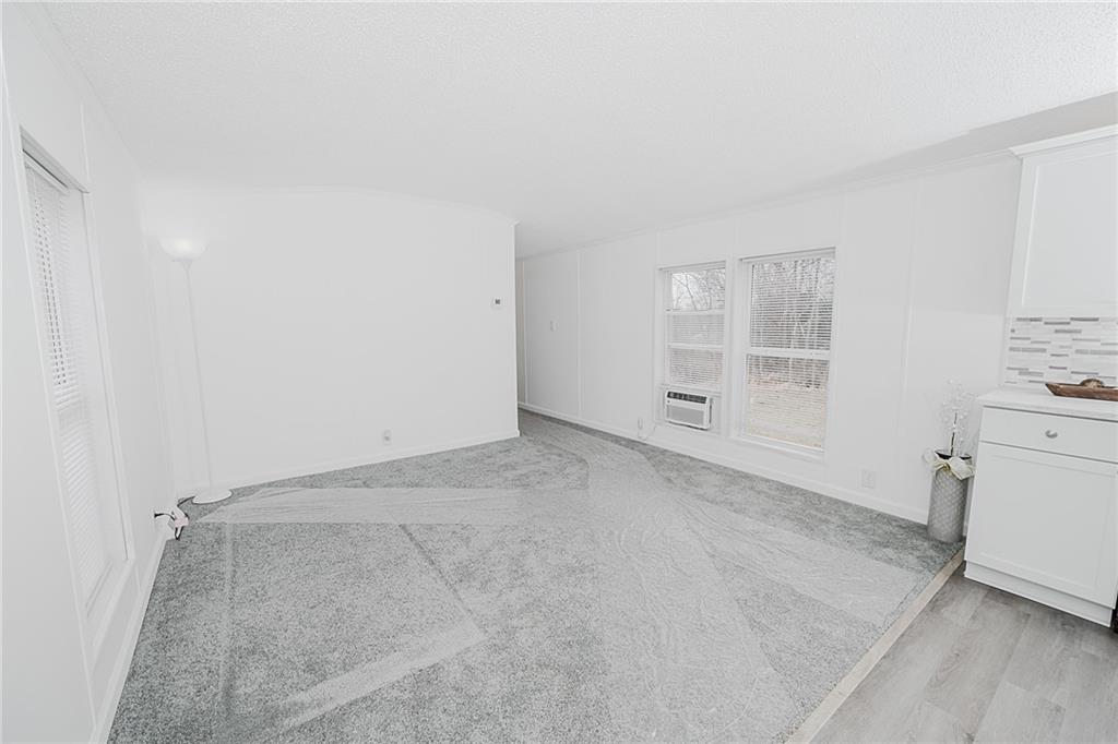 821 Windy Acres Road Saltsburg, PA 15681 - Photo 18 of 31 an empty room with closet and windows