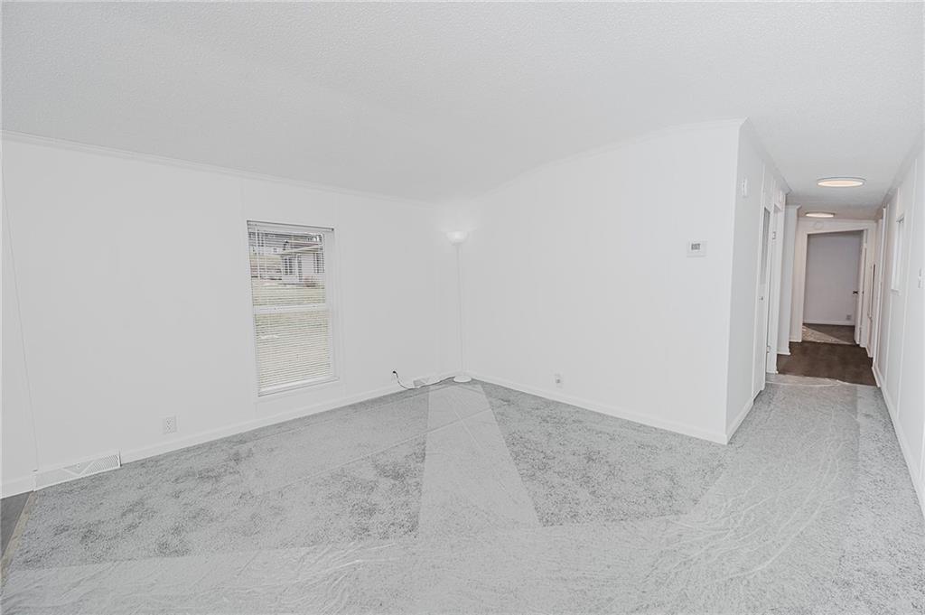 821 Windy Acres Road Saltsburg, PA 15681 - Photo 19 of 31 an empty room with windows