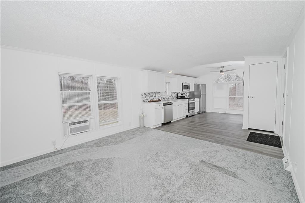 821 Windy Acres Road Saltsburg, PA 15681 - Photo 21 of 31 an empty room with a kitchen and a sink