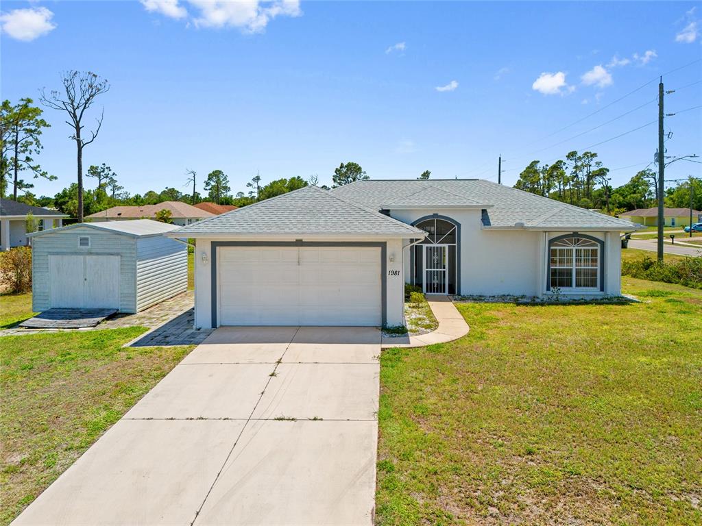 1981 Arena Lane North Port, FL 34286 - Photo 1 of 1 a front view of a house with a yard