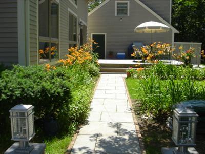 71 Upland Circle Brewster, MA 02631 - Photo 11 of 29 a front view of a house with a yard