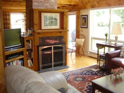 71 Upland Circle Brewster, MA 02631 - Photo 12 of 29 a living room with fireplace furniture and a flat screen tv