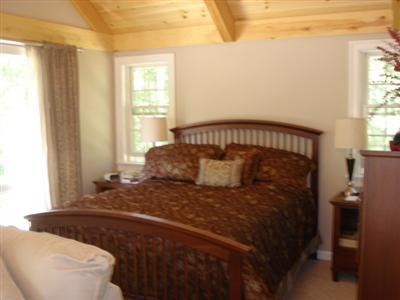71 Upland Circle Brewster, MA 02631 - Photo 16 of 29 a bedroom with a bed and window