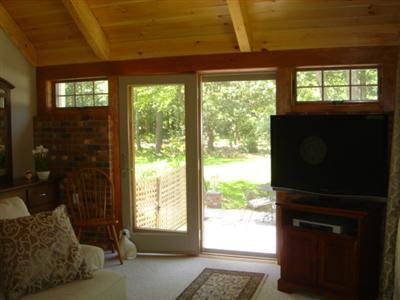 71 Upland Circle Brewster, MA 02631 - Photo 17 of 29 a living room with furniture and a window