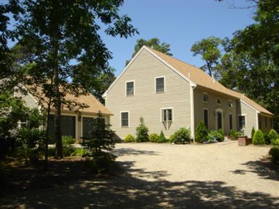 71 Upland Circle Brewster, MA 02631 - Photo 5 of 29 a front view of a house with a yard