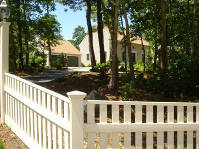 71 Upland Circle Brewster, MA 02631 - Photo 9 of 29 a view of a house with backyard and trees