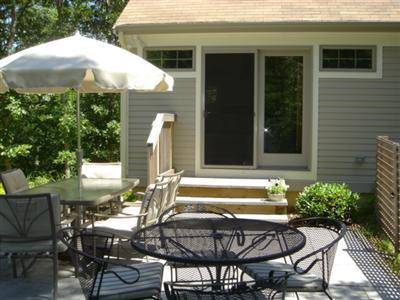 71 Upland Circle Brewster, MA 02631 - Photo 10 of 29 a view of a chairs and table in patio of the house