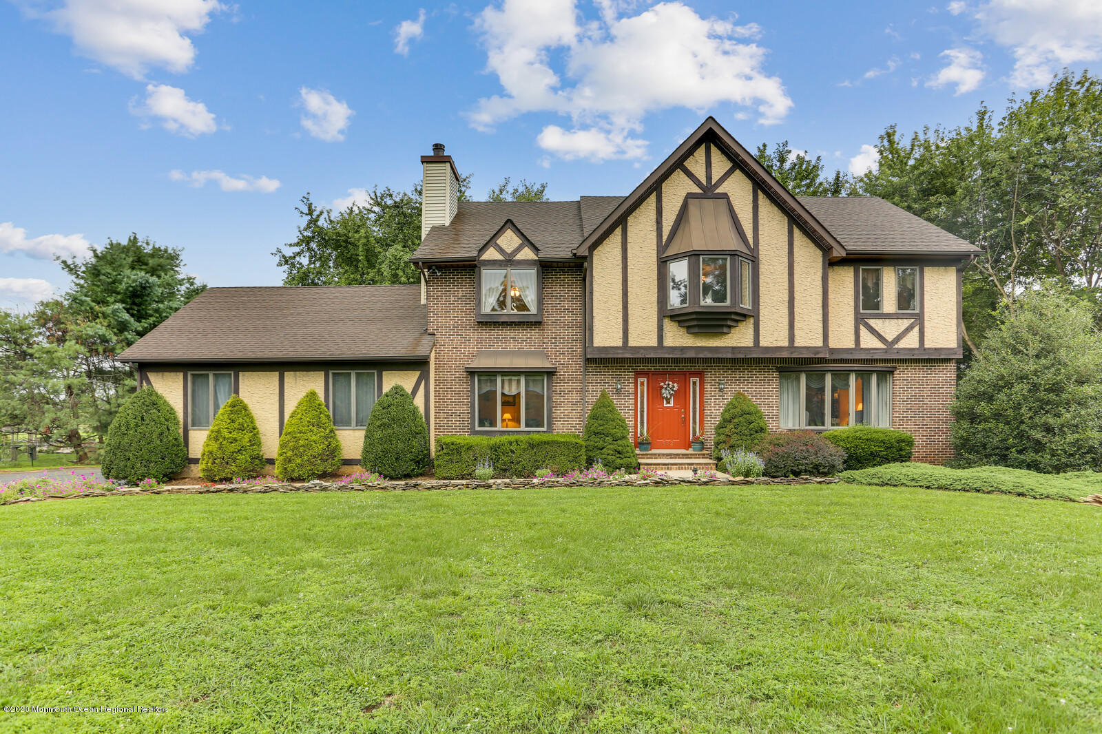 512 Province Line Road Allentown, NJ 08501 - Photo 1 of 38 a front view of a house with a yard and garage
