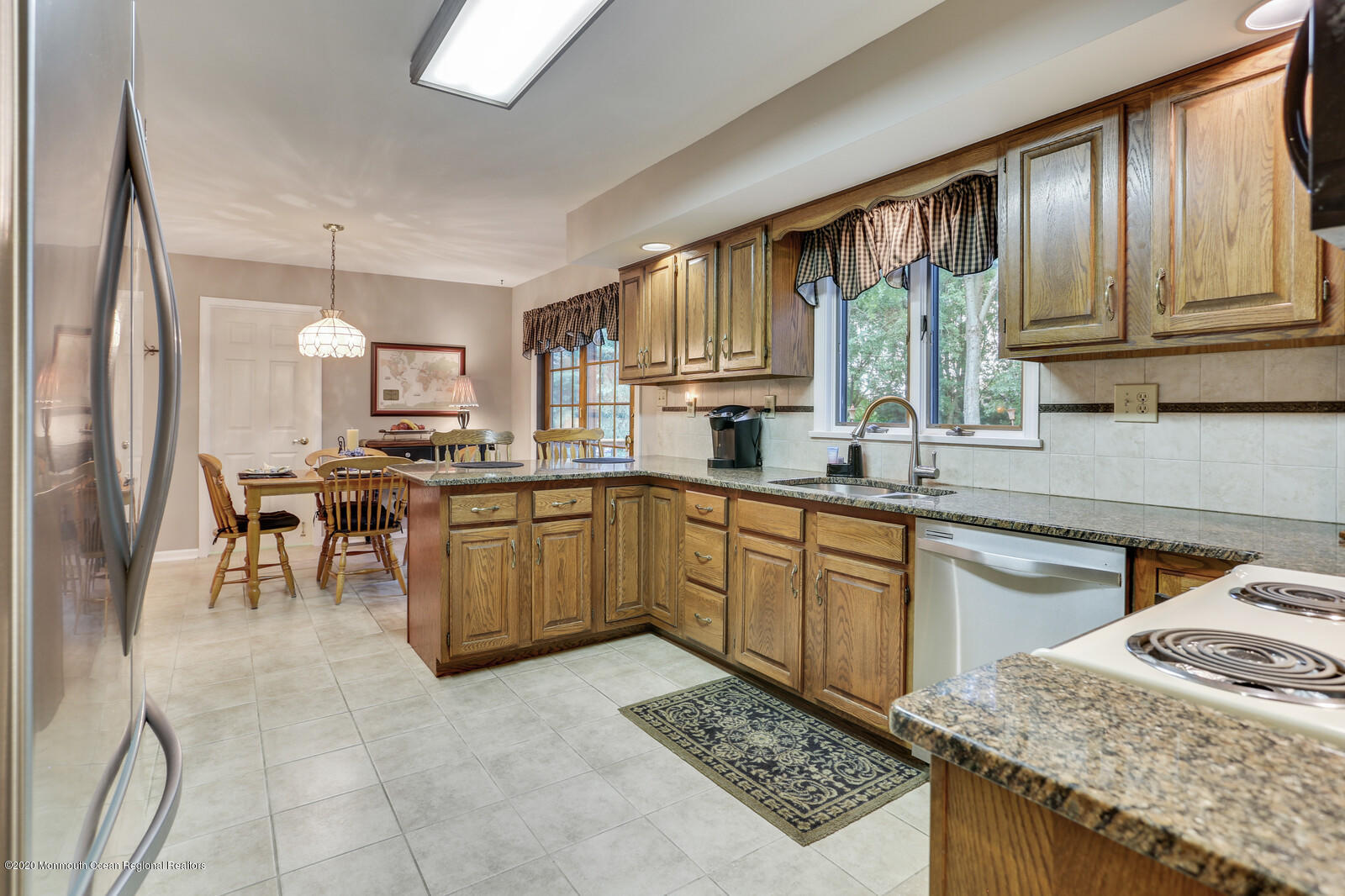 512 Province Line Road Allentown, NJ 08501 - Photo 11 of 38 a kitchen with a sink stove and cabinets