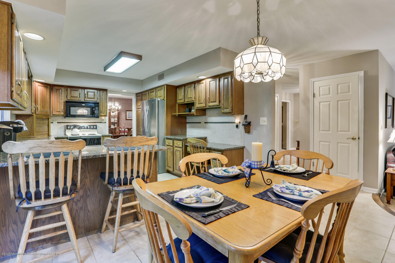 512 Province Line Road Allentown, NJ 08501 - Photo 16 of 38 a view of a dining room with furniture a chandelier and wooden floor