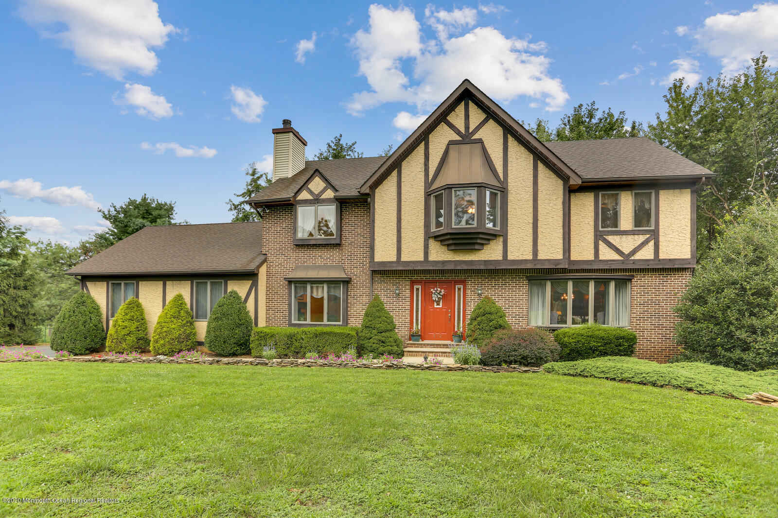 512 Province Line Road Allentown, NJ 08501 - Photo 3 of 38 a front view of a house with a yard and garage