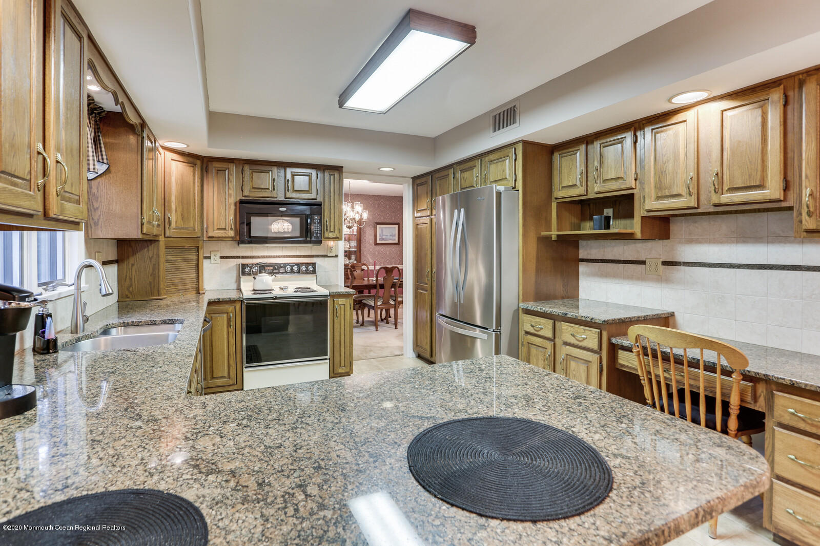 512 Province Line Road Allentown, NJ 08501 - Photo 10 of 38 a kitchen with stainless steel appliances granite countertop a stove a sink a refrigerator a window