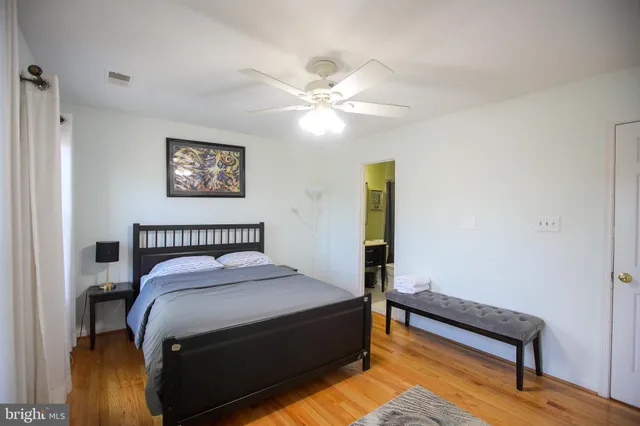 a bedroom with a bed and a bookshelf