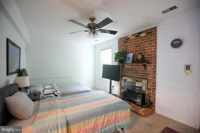 a bedroom with a bed and a television