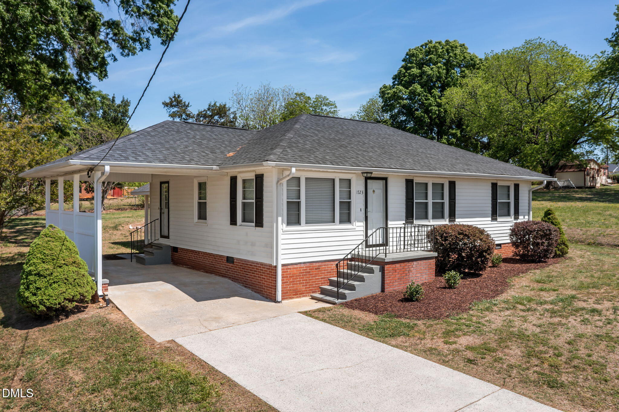 1723 Power Line Road Elon, NC 27244 - Photo 2 of 22 a front view of a house with a yard