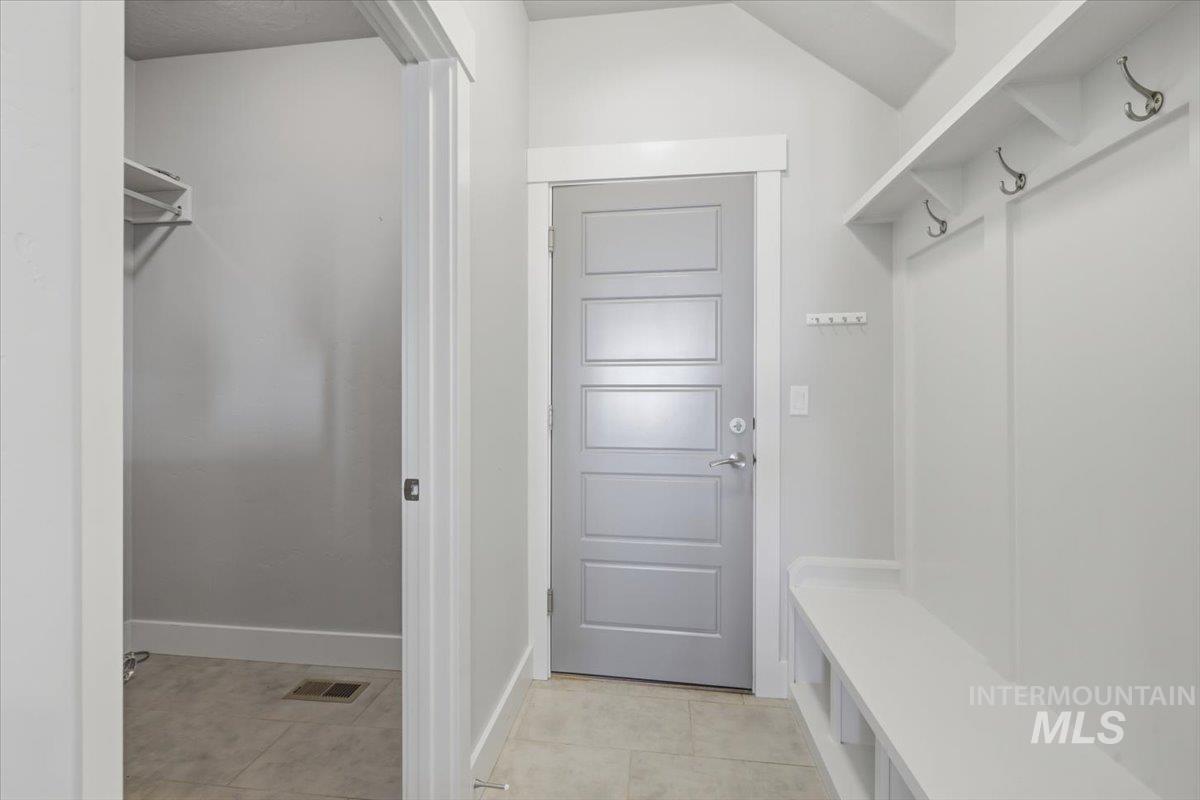 15381 Silver Oak Way Caldwell, ID 83607 - Photo 21 of 48 Mudroom with light tile patterned floors and baseboards